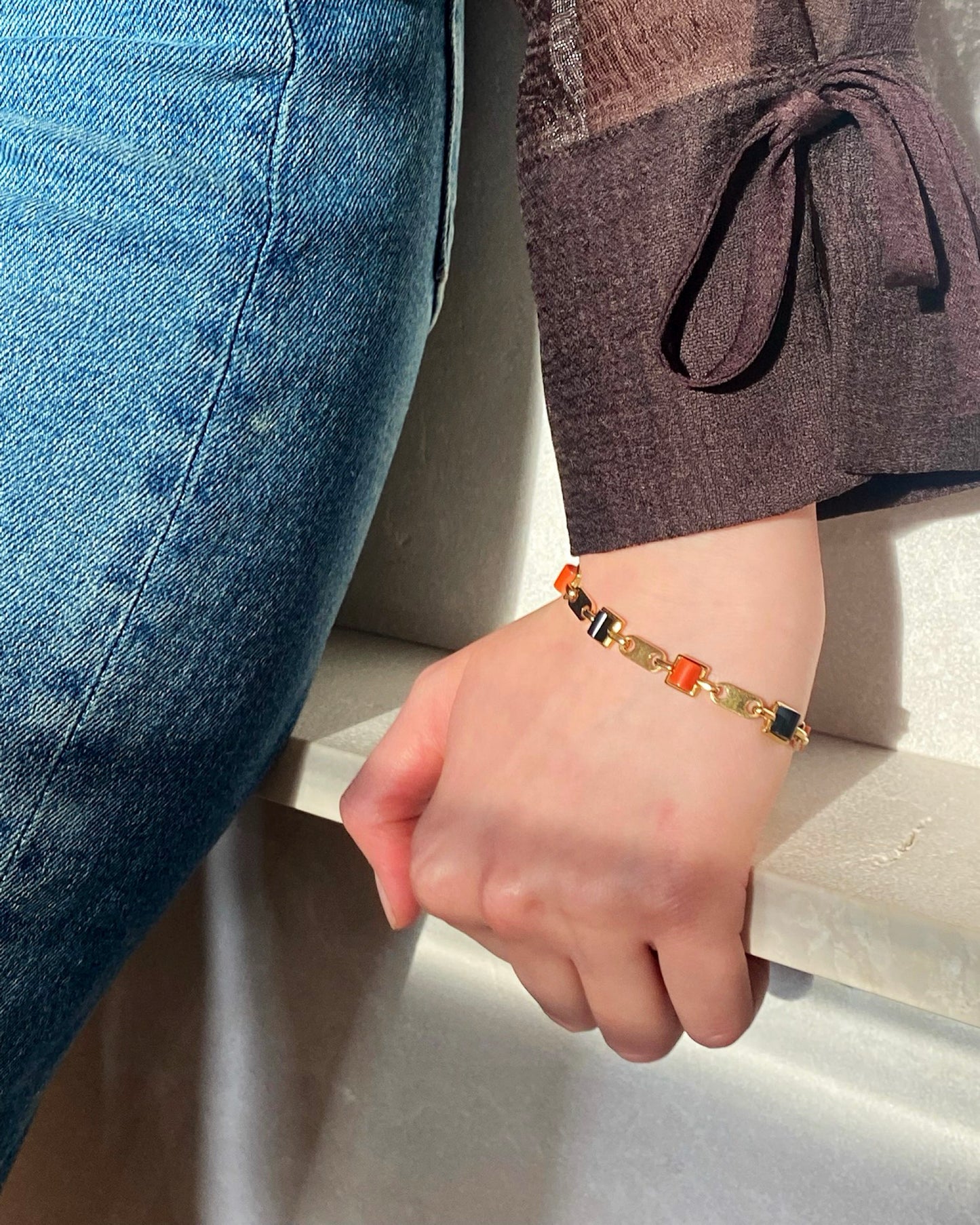 CARTIER GOLD, CORAL & ONYX LINKS BRACELET, 1970s