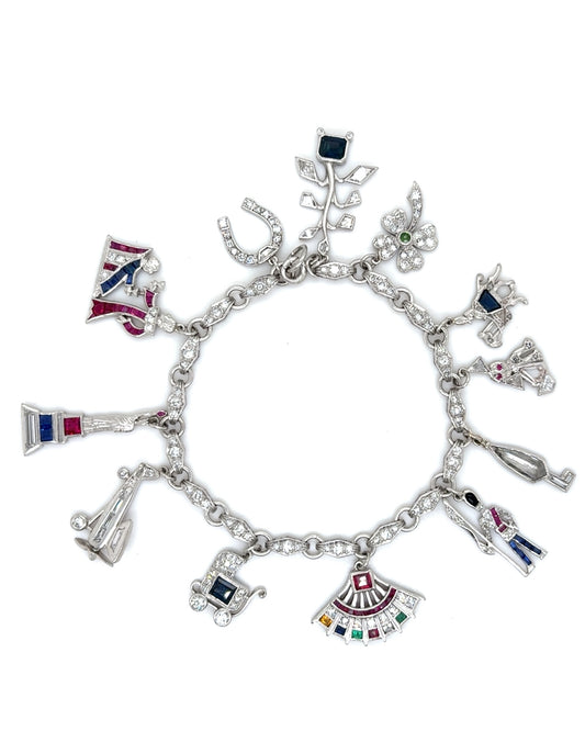 ART DÉCO DIAMOND, COLOURED GEMSTONES & PLATINUM BRACELET WITH 12 CHARMS, INCL. 1 BY CARTIER