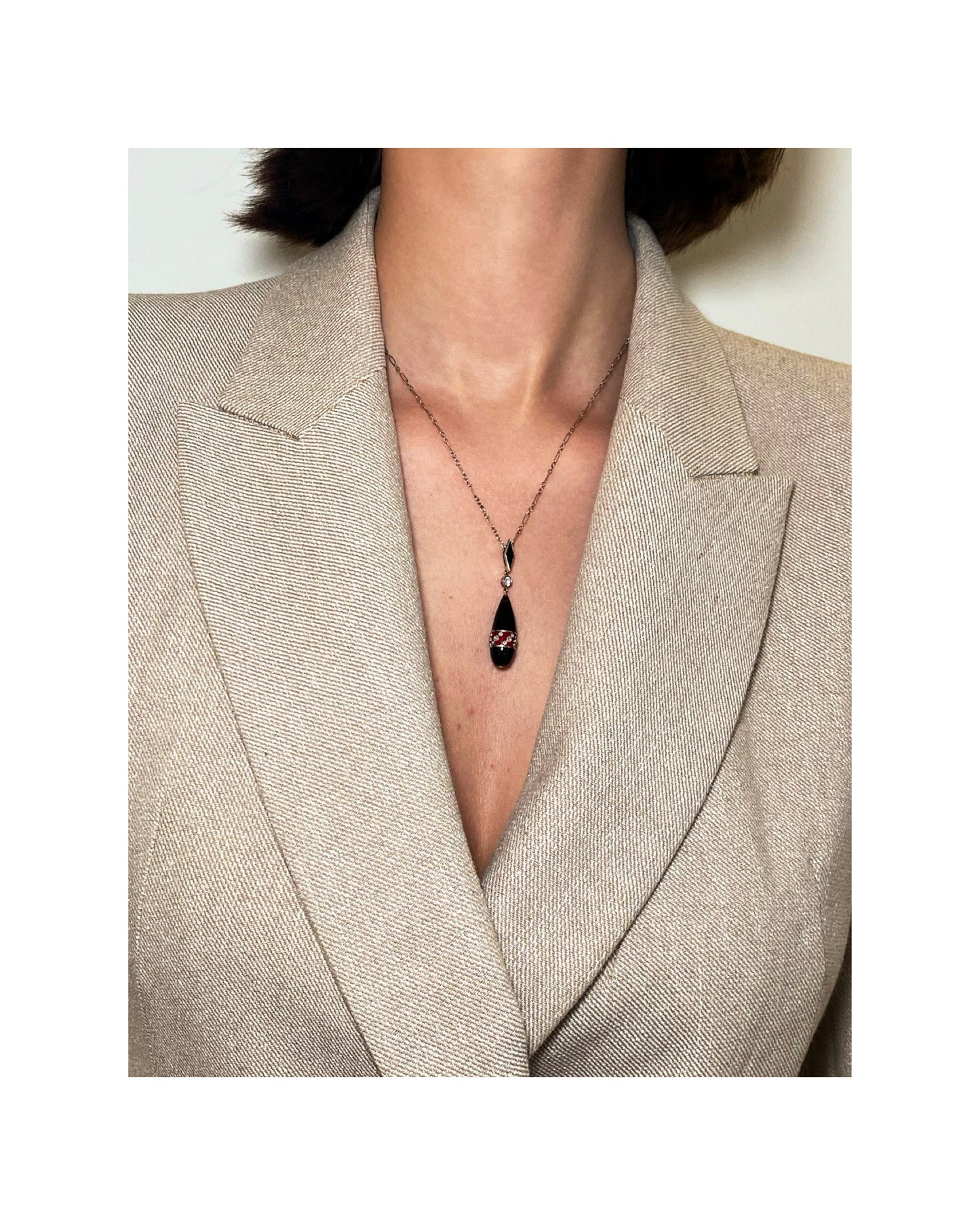 ART DÉCO DIAMOND, ENAMEL, ONYX, PLATINUM & GOLD PENDANT NECKLACE, 1920s