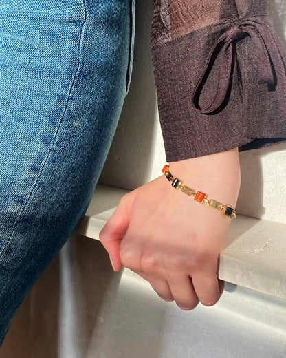 CARTIER GOLD, CORAL & ONYX LINKS BRACELET, 1970s