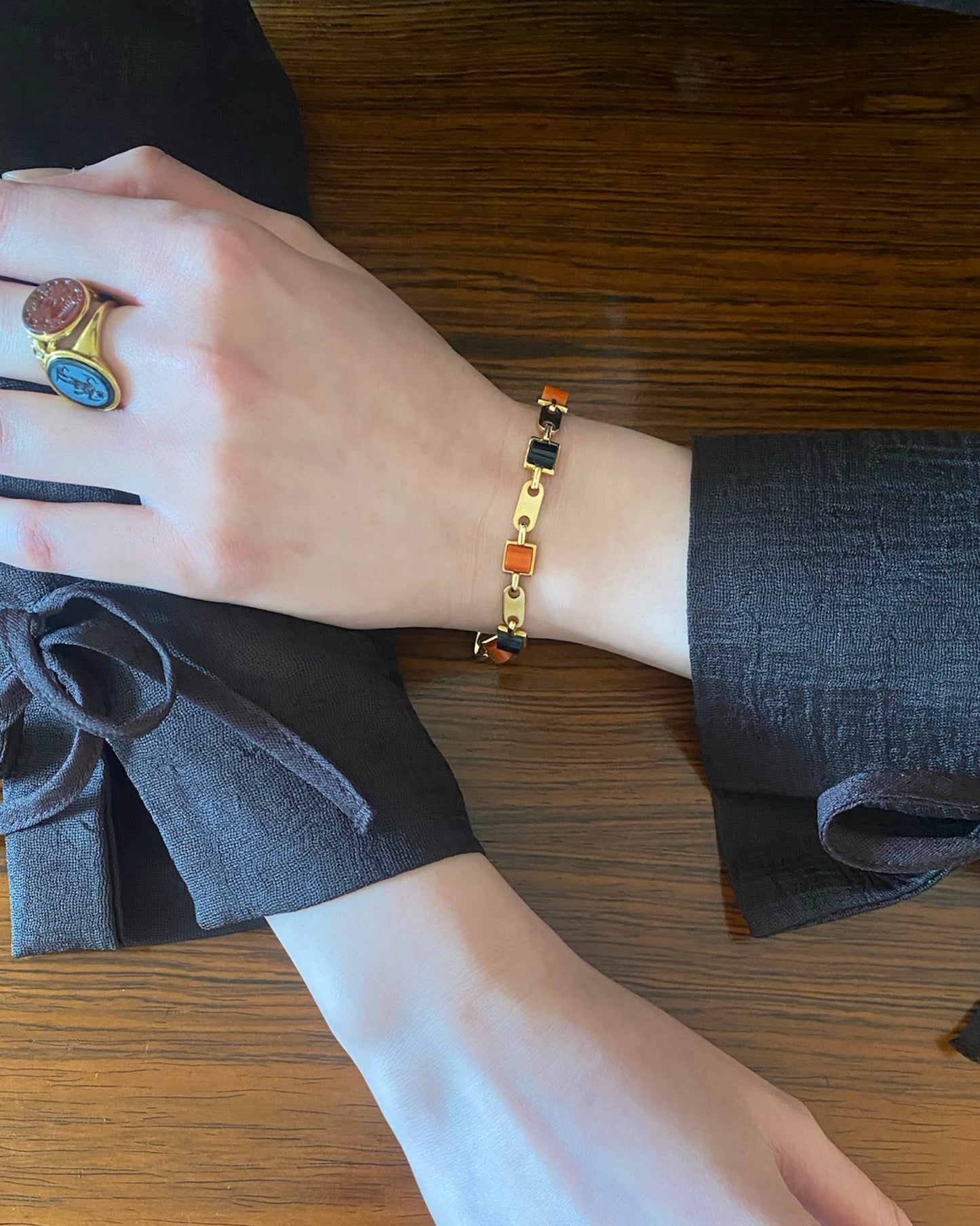 CARTIER GOLD, CORAL & ONYX LINKS BRACELET, 1970s