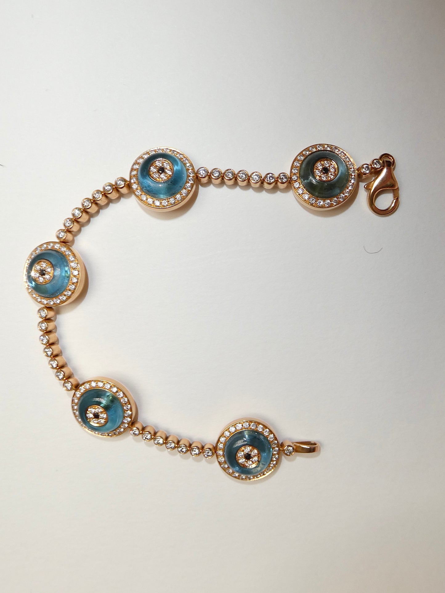 LORRAINE SCHWARTZ 'AGAINST EVIL EYE FIVE EYE' ROSE GOLD, DIAMOND & TOPAZ BRACELET, 21st CENTURY