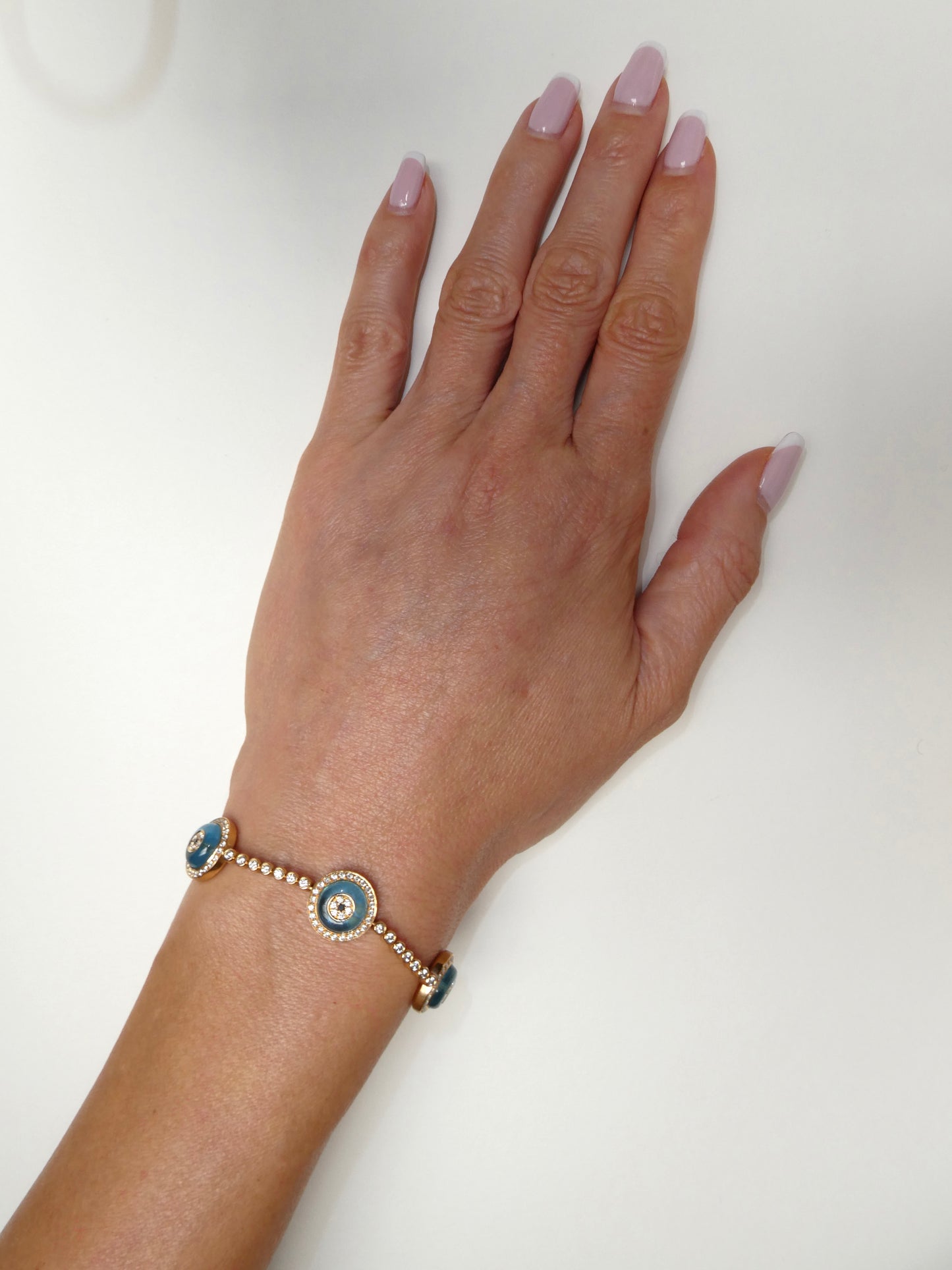 LORRAINE SCHWARTZ 'AGAINST EVIL EYE FIVE EYE' ROSE GOLD, DIAMOND & TOPAZ BRACELET, 21st CENTURY