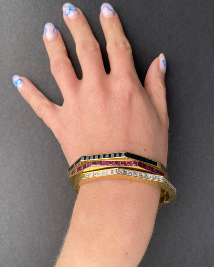 TRIO OF YELLOW GOLD BRACELETS WITH DIAMONDS, BURMA RUBIES & MONTANA SAPPHIRES, 1960s