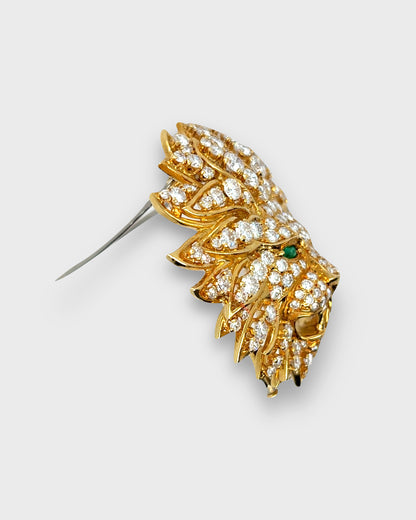 VAN CLEEF & ARPELS DIAMONDS, EMERALDS & YELLOW GOLD LION BROOCH, 1970s