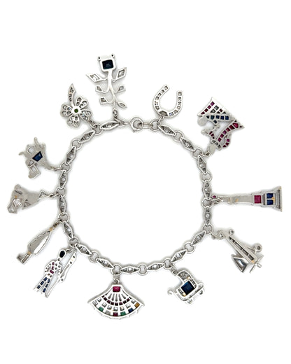 ART DÉCO DIAMOND, COLOURED GEMSTONES & PLATINUM BRACELET WITH 12 CHARMS, INCL. 1 BY CARTIER