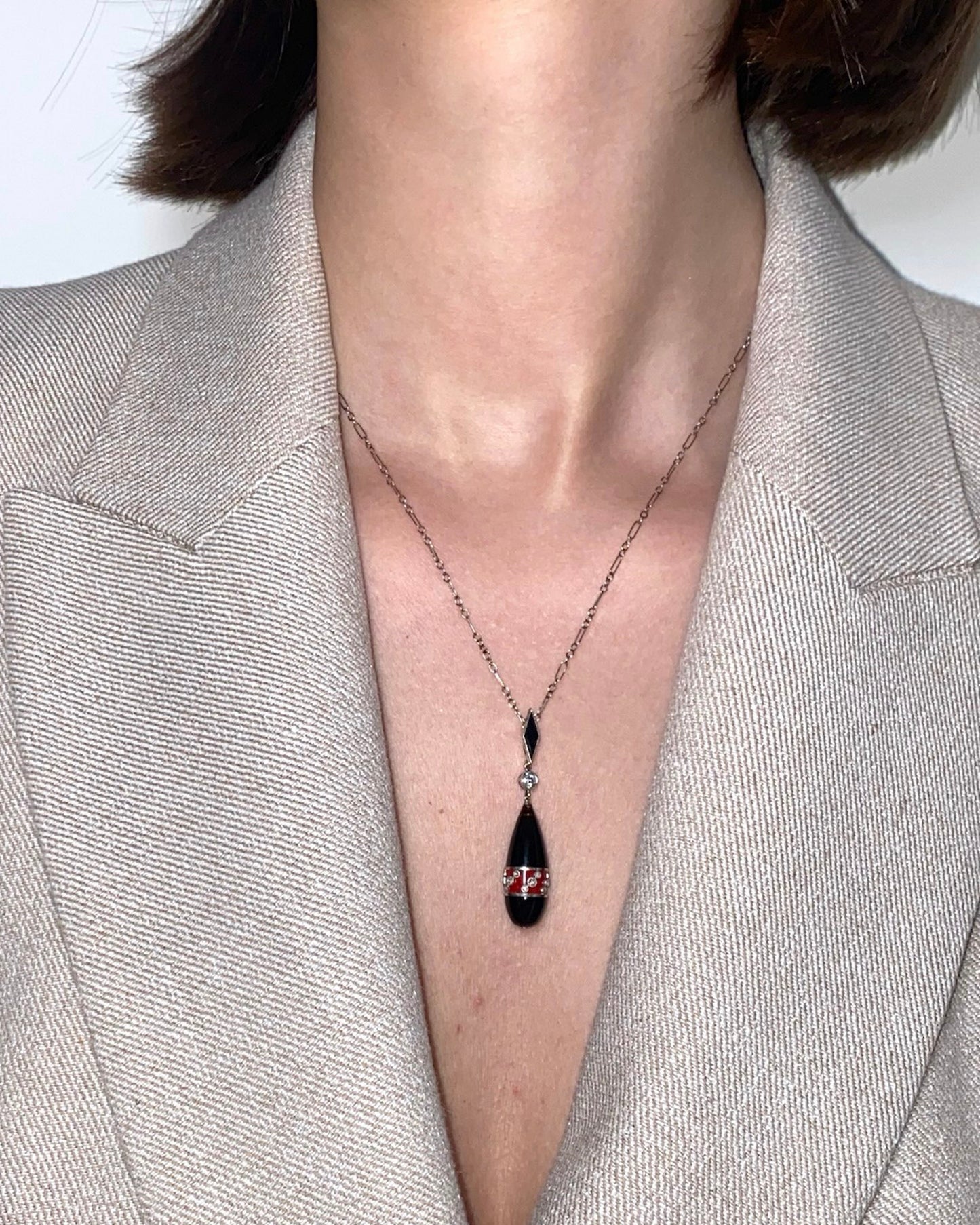 ART DÉCO DIAMOND, ENAMEL, ONYX, PLATINUM & GOLD PENDANT NECKLACE, 1920s