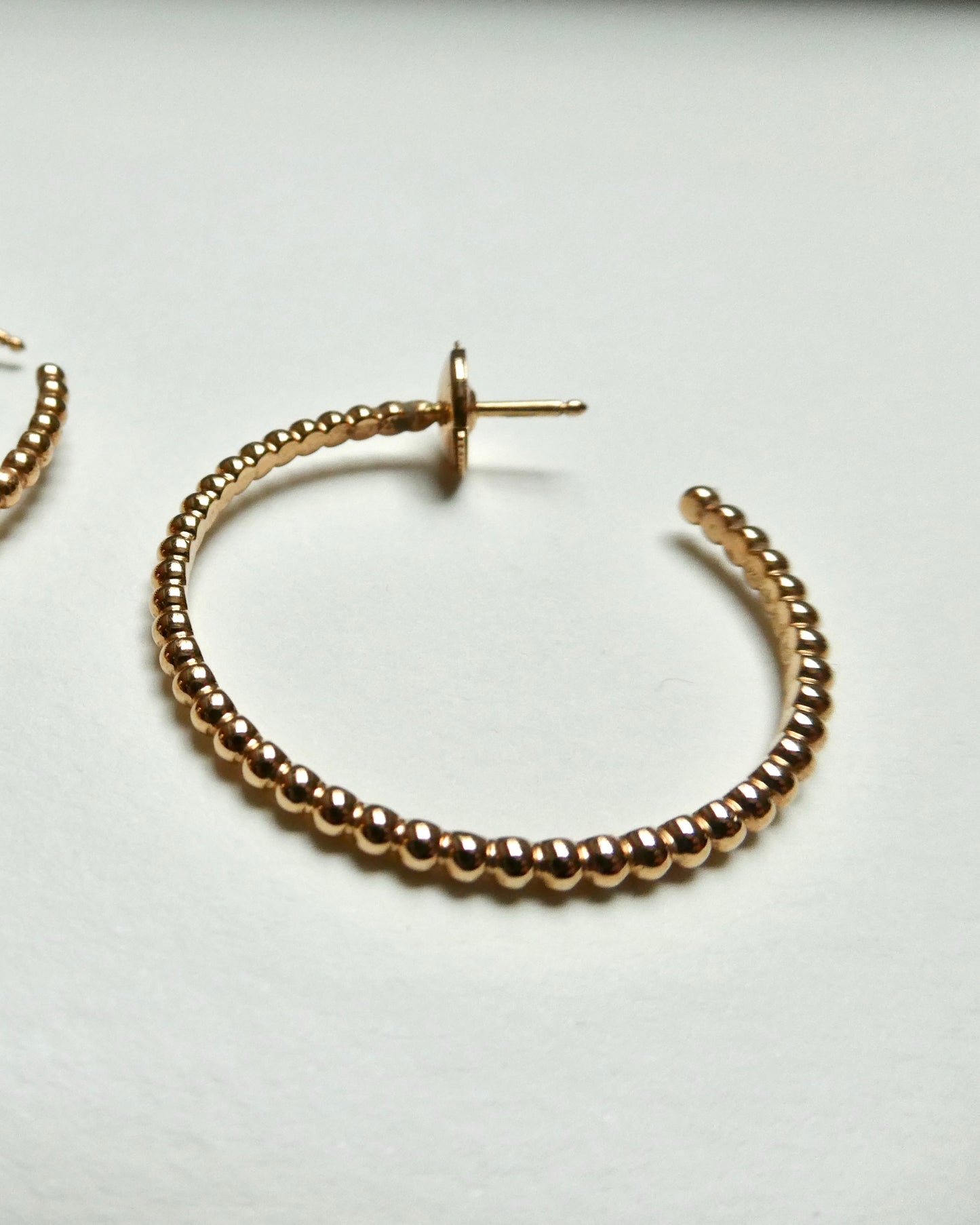 VAN CLEEF & ARPELS 'PERLÉE' YELLOW GOLD HOOP EARRINGS, 21st CENTURY