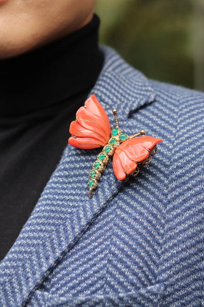 A MONUMENTAL ITALIAN BUTTERFLY BROOCH with eight cabochon emeralds and diamonds over coral
