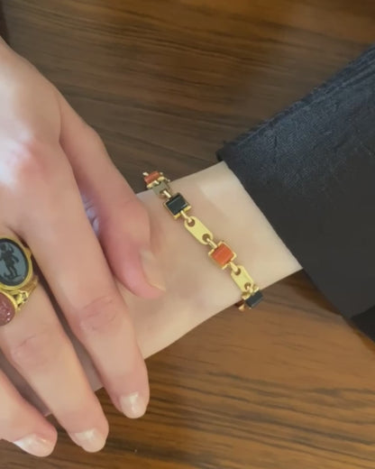 CARTIER GOLD, CORAL & ONYX LINKS BRACELET, 1970s