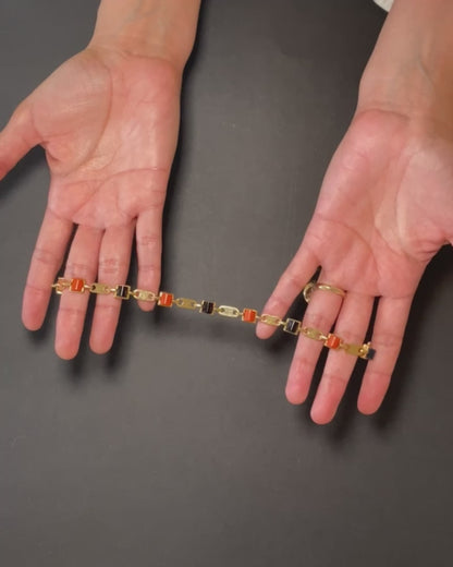 CARTIER GOLD, CORAL & ONYX LINKS BRACELET, 1970s