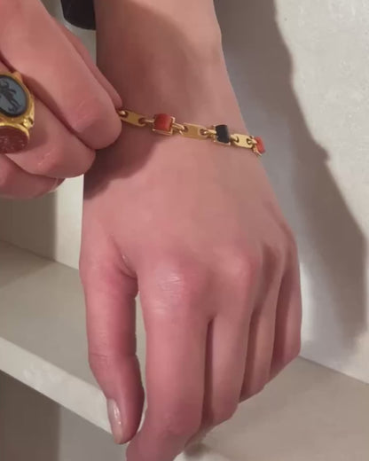 CARTIER GOLD, CORAL & ONYX LINKS BRACELET, 1970s