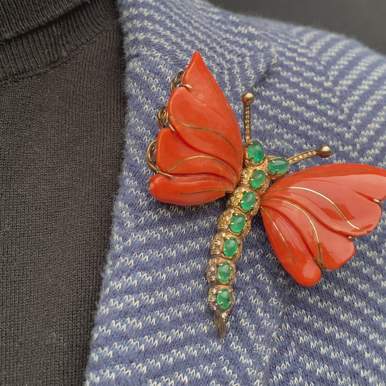 A MONUMENTAL ITALIAN BUTTERFLY BROOCH with eight cabochon emeralds and diamonds over coral