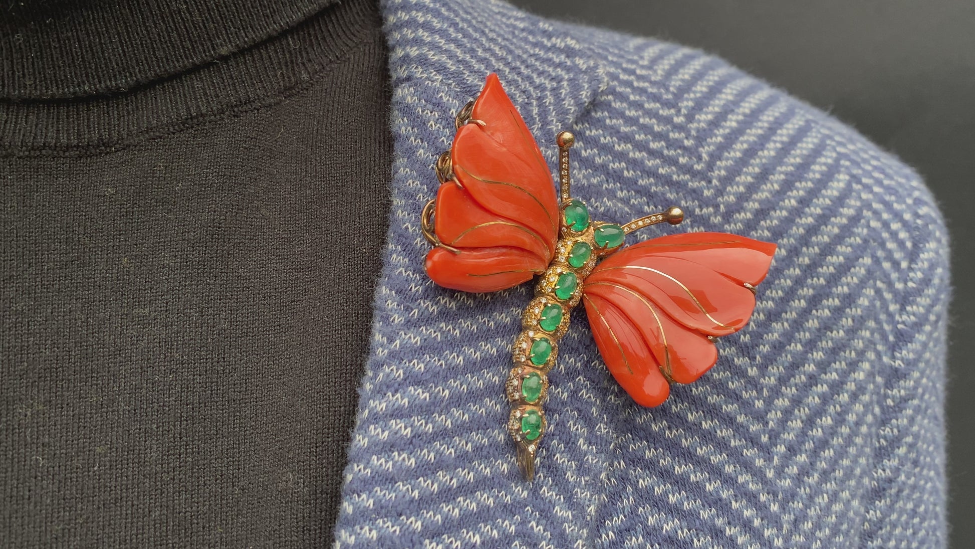 A MONUMENTAL ITALIAN BUTTERFLY BROOCH with eight cabochon emeralds and diamonds over coral