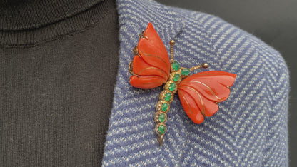 A MONUMENTAL ITALIAN BUTTERFLY BROOCH with eight cabochon emeralds and diamonds over coral