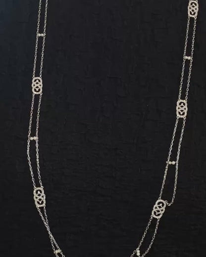 EDWARDIAN DIAMOND, NATURAL PEARL & PLATINUM SAUTOIR, 1915